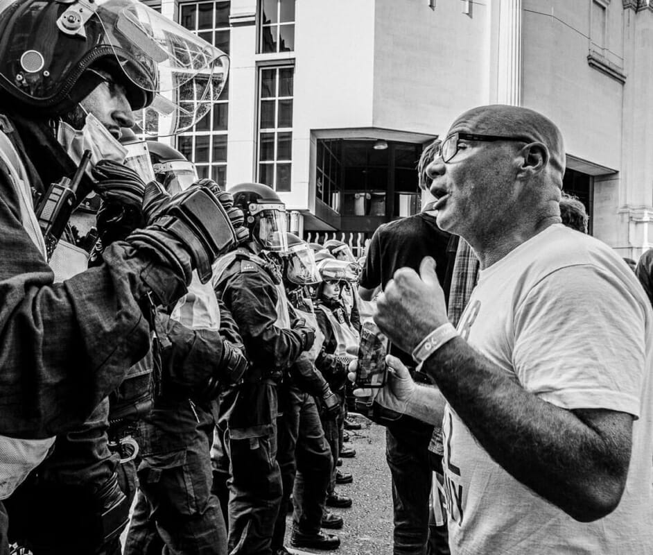 Riot Police vs Protestor Riot Police vs Protestor - Resist and Act For Freedom Rally London - Photo Documentary