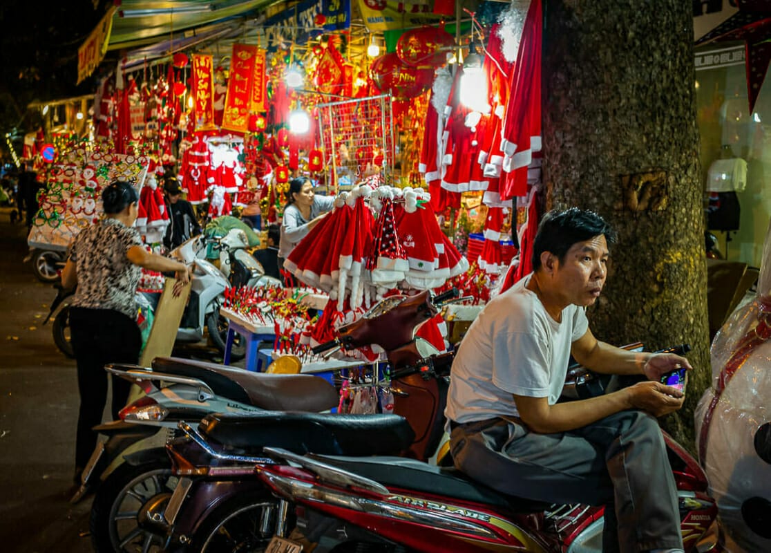 He can't find the Christmas Stall He can't find the Christmas Stall - Hanoi - Vietnam - Street Photography Documentary