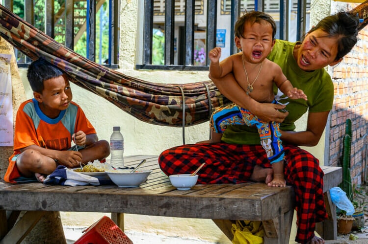 Calming the Baby - Bamboo Train Battambang - Rural Cambodia - Street Photography Documentary