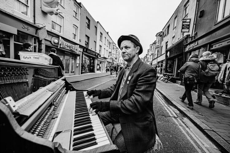 Piano Player in the Road - Dynamic Street Photography - Brighton